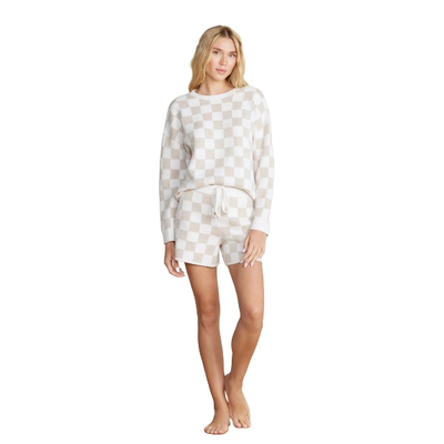 MODEL WEARING BAREFOOT DREAMS COZY CHIC COTTON CHECKERED SHORT IN COLOR OATMEAL CREAM