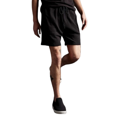 MODEL WEARING JAMES PERSE FRENCH TERRY SWEAT SHORT IN BLACK